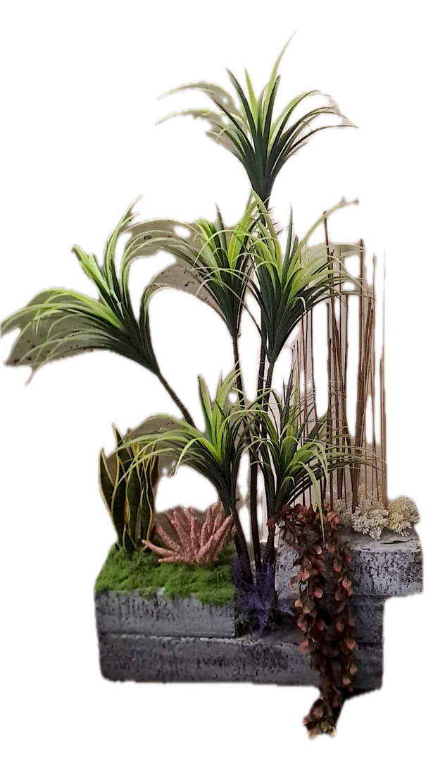 Composición artificial de yucas con jardineras de piedra y bambú