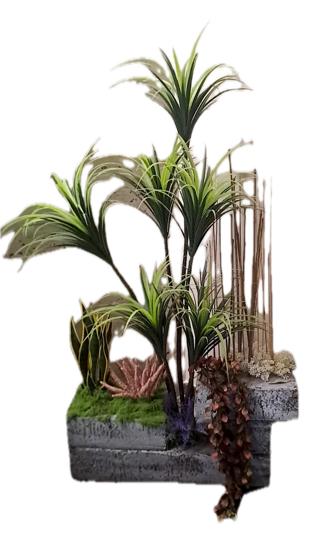 Composición artificial de yucas con jardineras de piedra y bambú